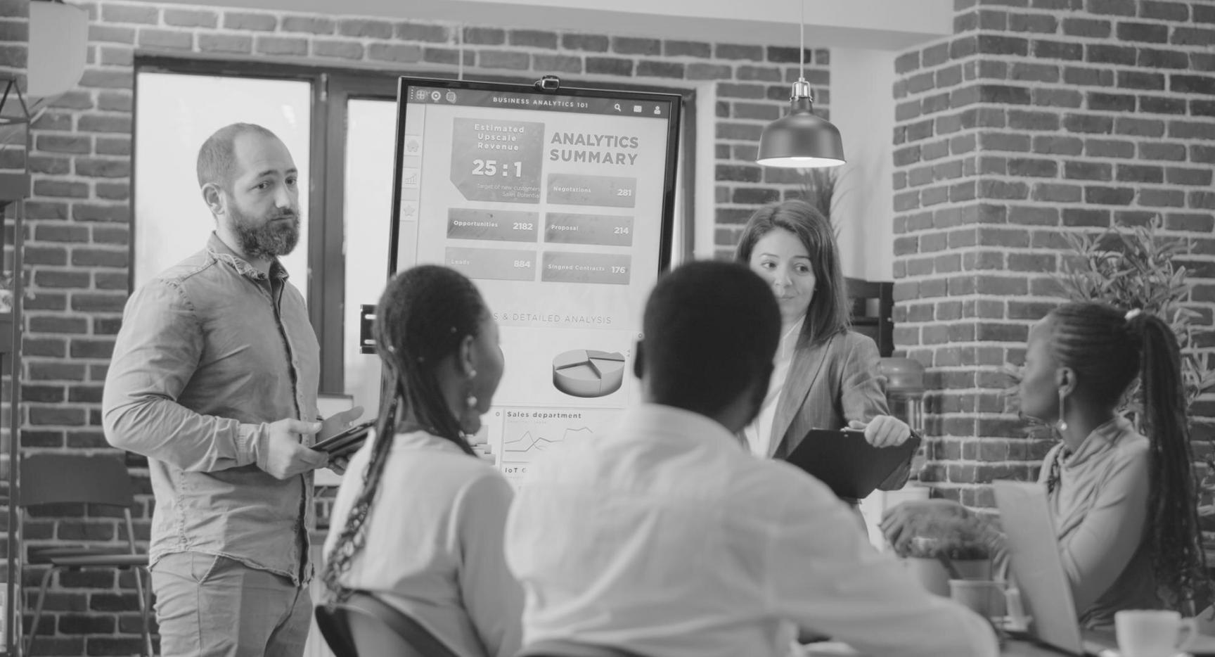 Business owner reviewing financial reports and budgeting documents at desk