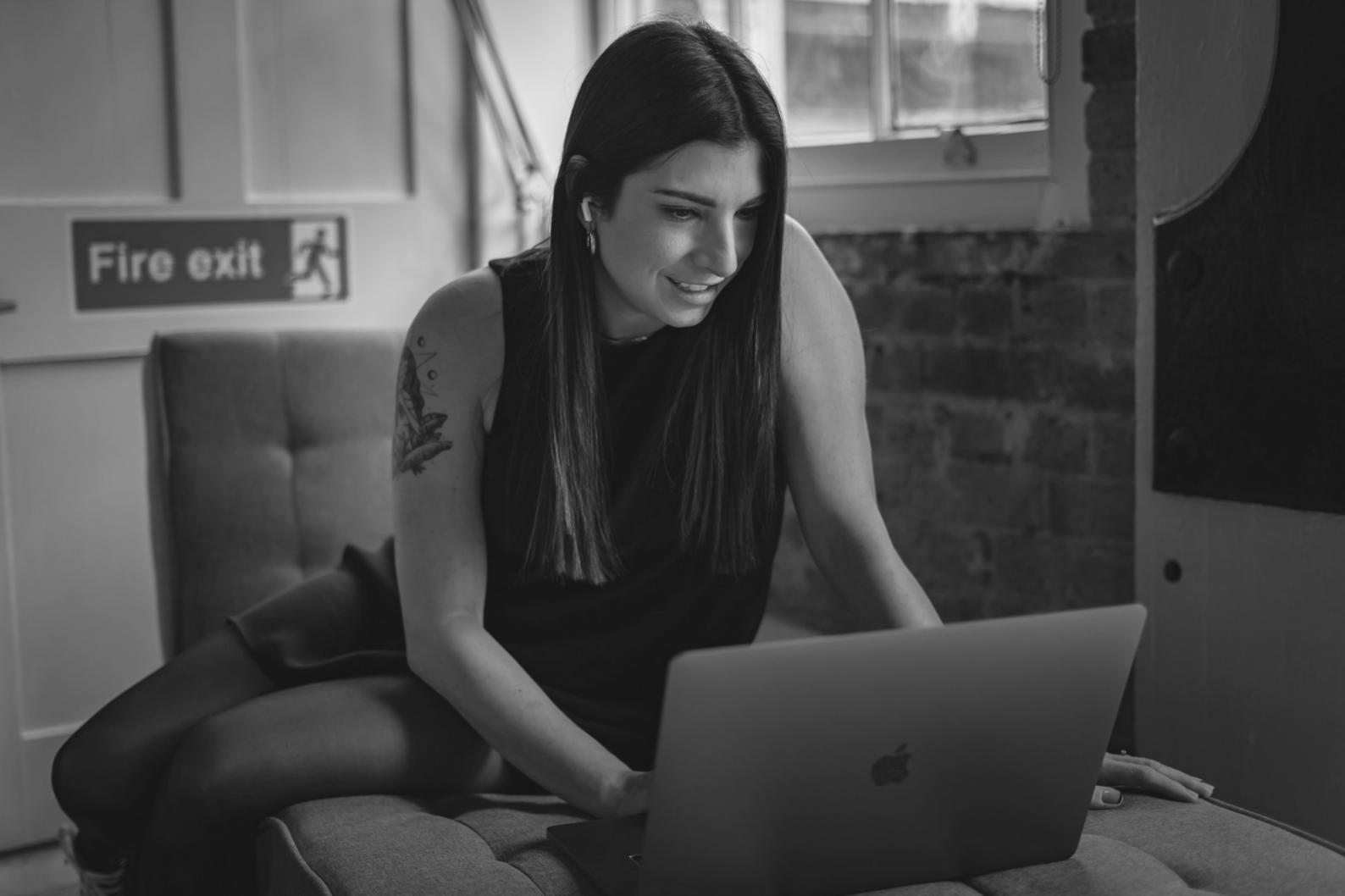 Business owner reviewing financial dashboard on laptop